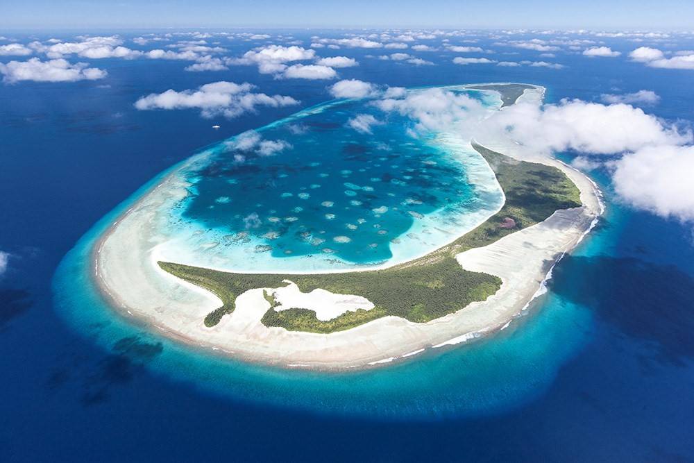 环状珊瑚礁(环礁)究竟是如何形成的?_火山岛