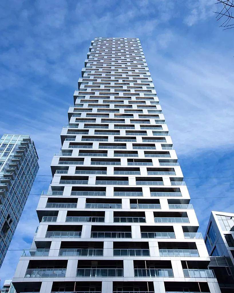 buildings which rise above a new waterfront community, the 