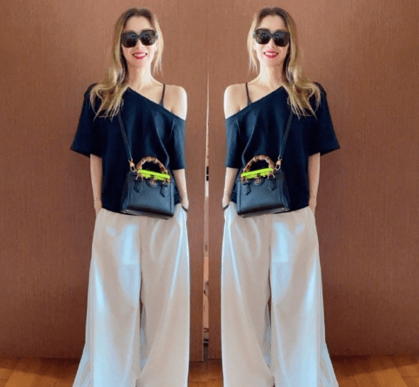 黑色 49岁郑秀文造型太大胆！穿蕾丝吊带身材干瘪，戴粗大金属链好雷人