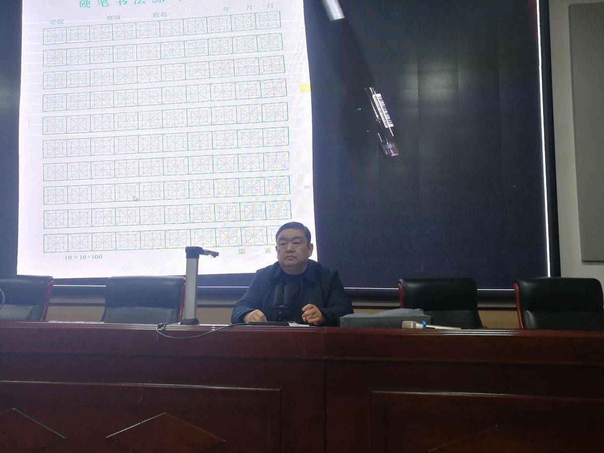 濮阳市著名书法家王石刚老师到市油田第五中学做书法讲座