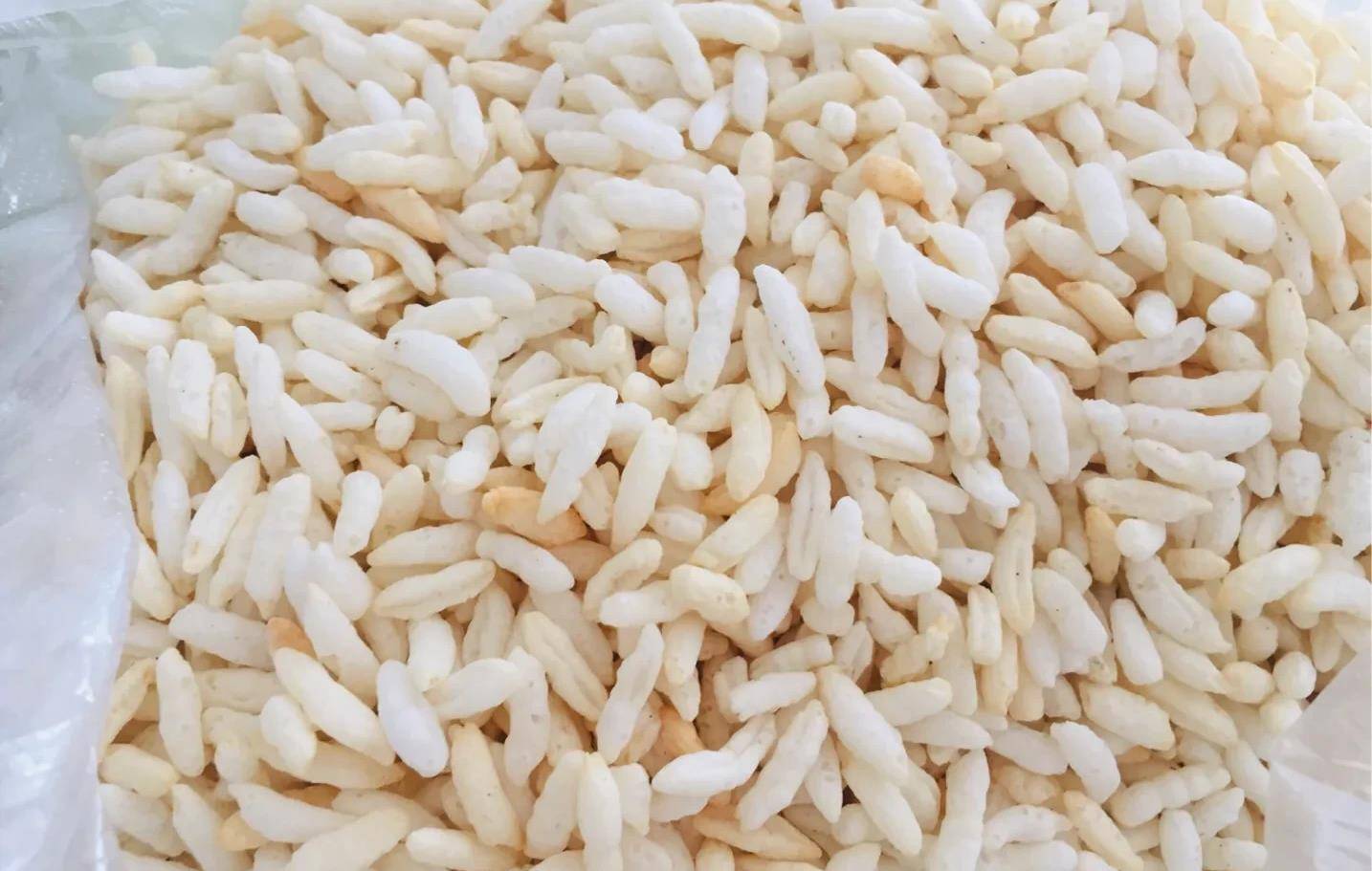 的炒米是擂茶里最讲究特别的佐料,以前,炒米都是选用秋收上等的油尖米