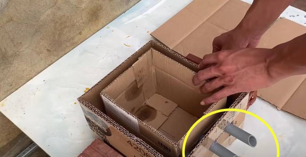 废弃纸箱裁剪造型,抹上水泥后自制一个瀑布鱼池,放院里赏心悦目_船型