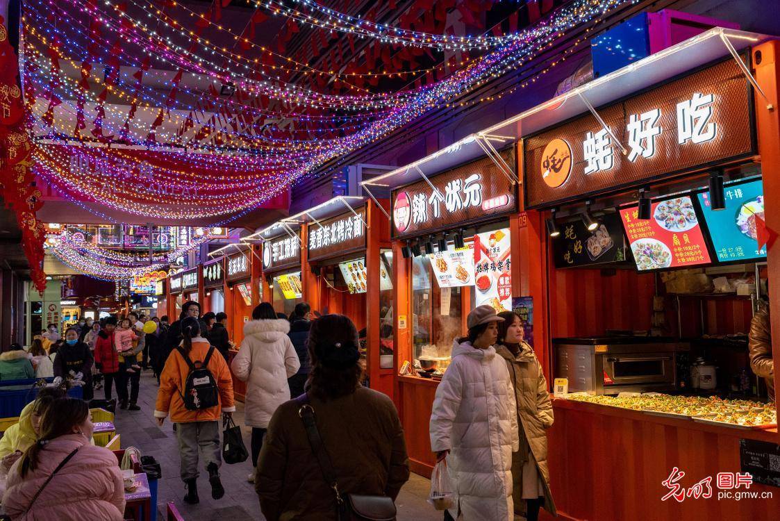 people enjoy food at night fair in hefei, east chinas anhui