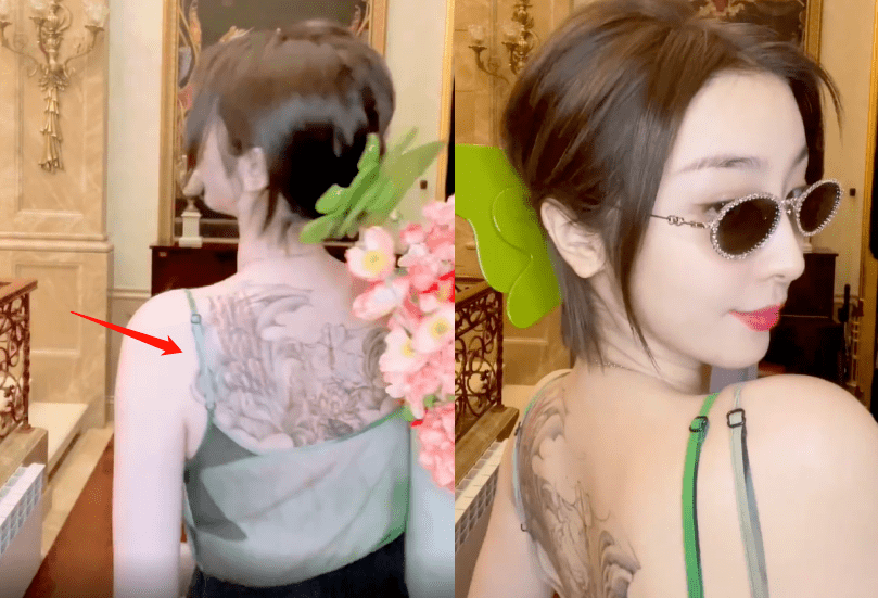 当天赵小棠穿着吊带长裙,在背对镜头时,她白皙的背部纹着大片纹身格外